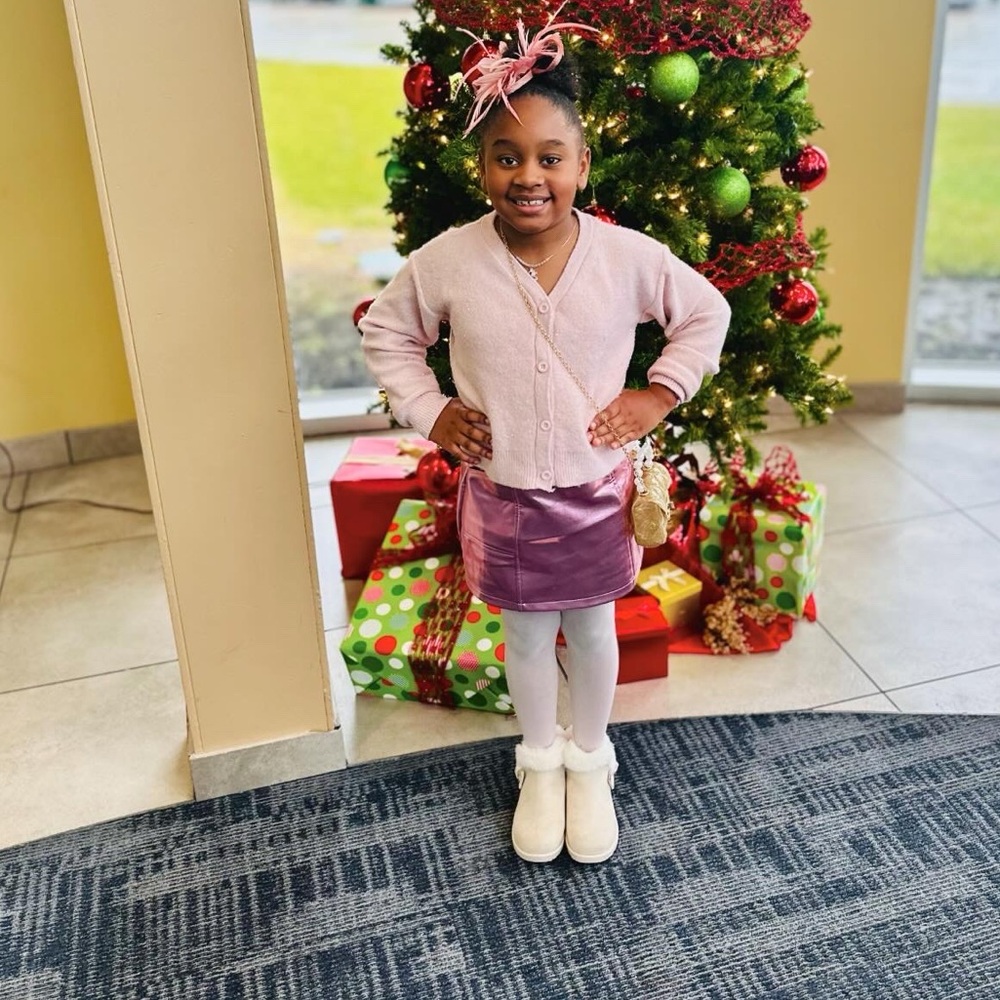 Pink sparkle cardigan paired with a retro platinum pink minister